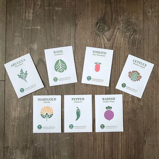 Set of vegetable seed packets on a wooden surface