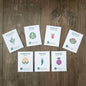 Set of vegetable seed packets on a wooden surface